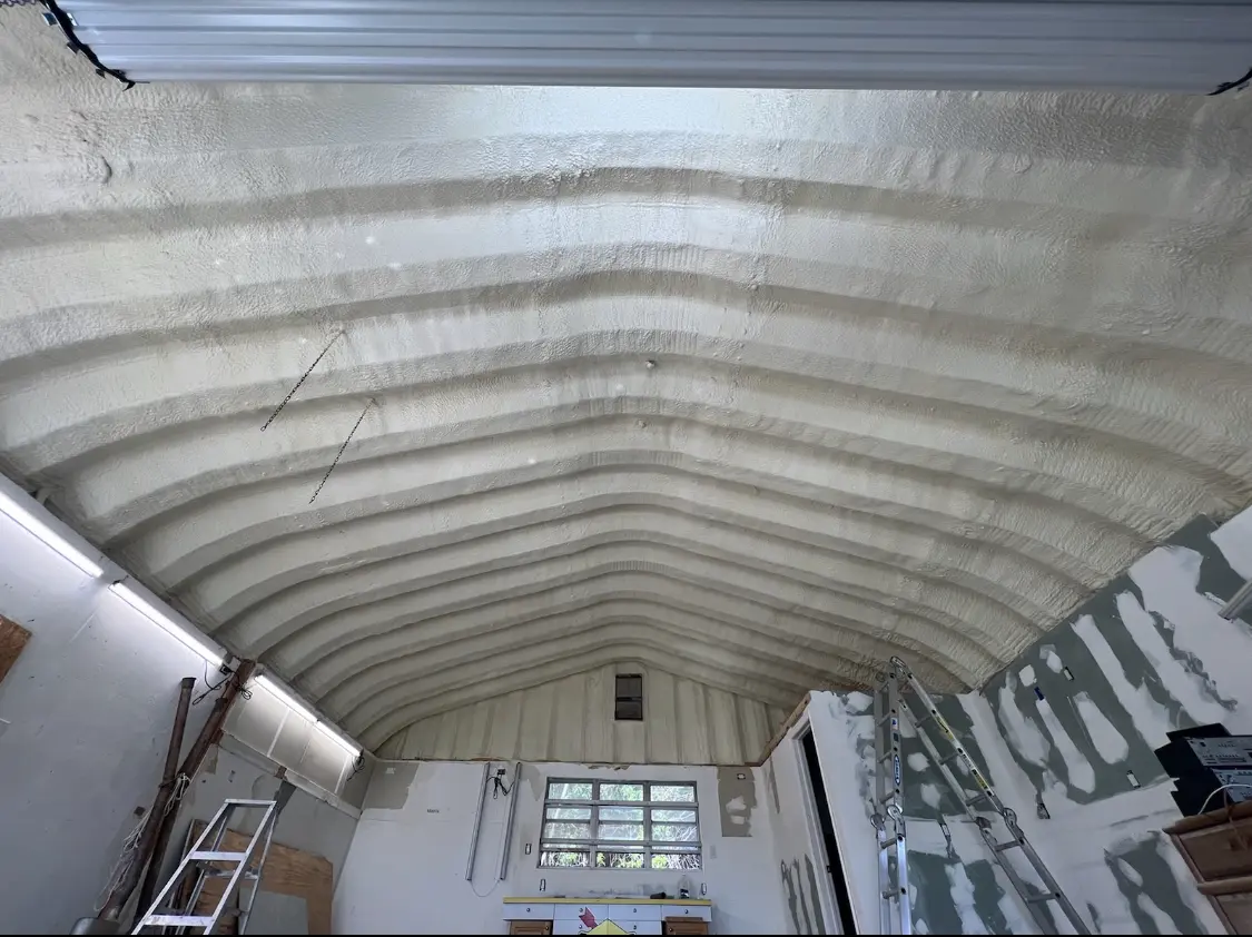 Spray polyurethane foam applied to the underside of a metal roof deck in South Williamsport